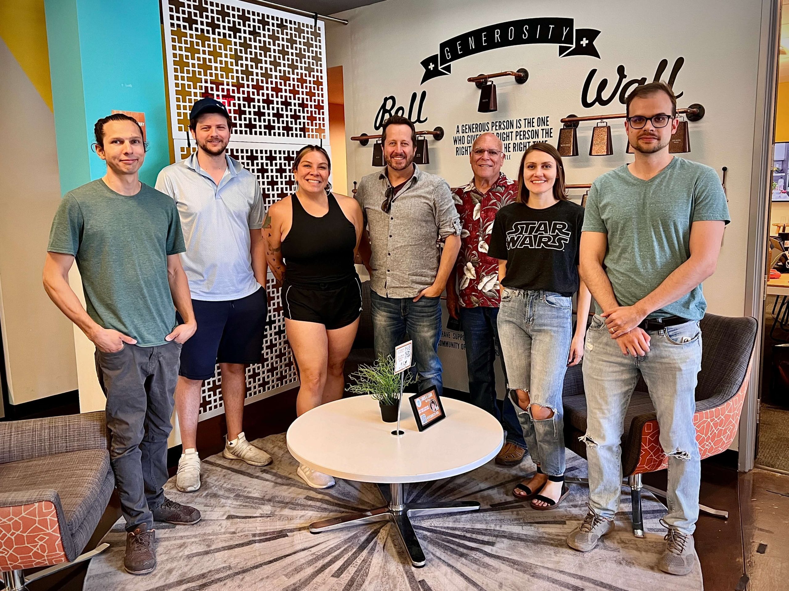 group of men and women posing for a Divi PHX picture